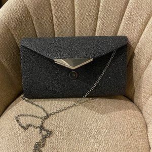 Woman’s silver clutch Nina New York